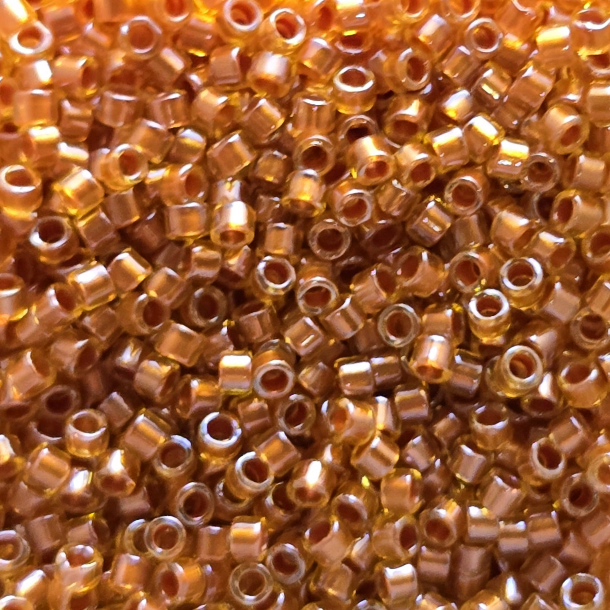 Miyuki Delica 11/0 Copper Pear Lined Marigold (1702) Miyuki Delica 11/0 Copper Pear Lined Marigold (1702) - immagine 1
